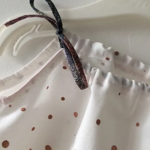 Barboteuse bébé en popeline pois cuivré