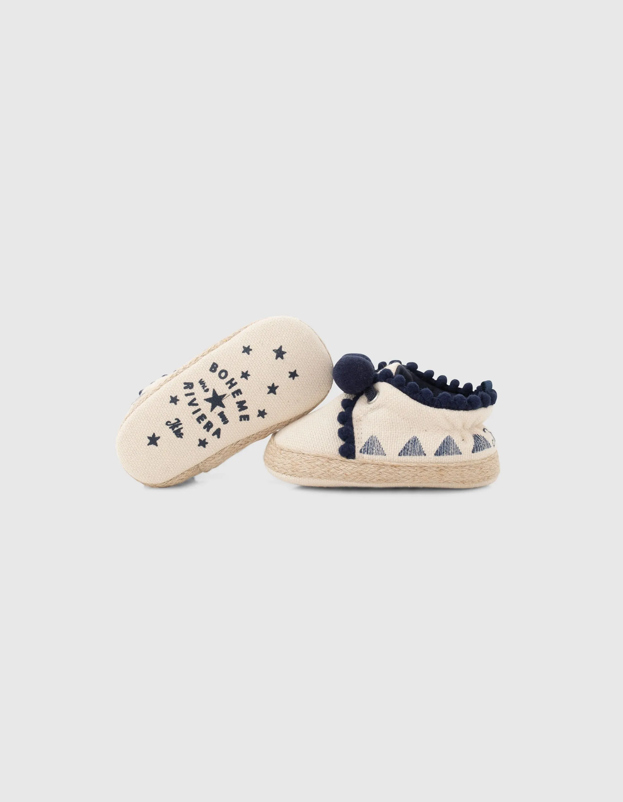 Chaussures blanc cassé en toile avec pompons bébé fille